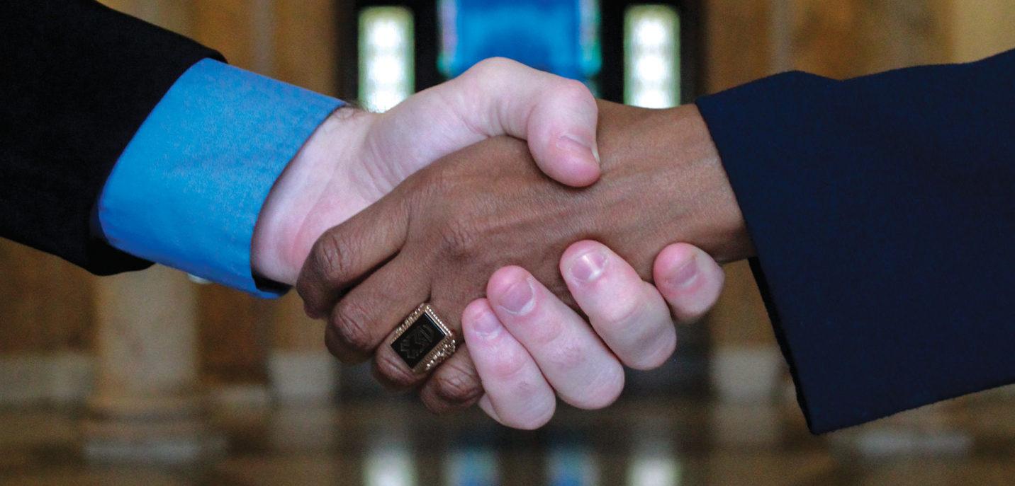 shaking hands in Rotunda